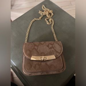 Little animal print, vegan leather crossbody bag.